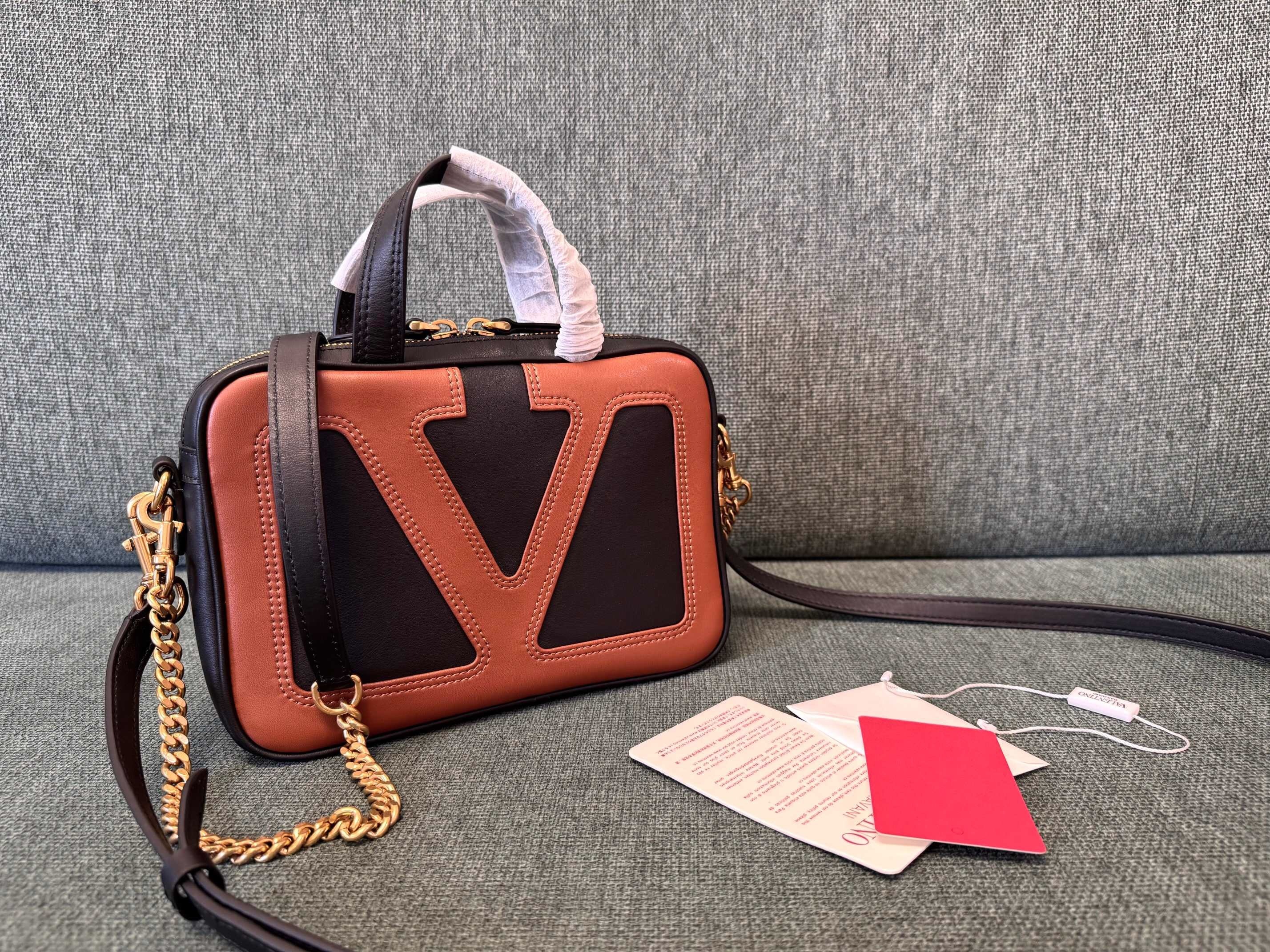 Valentino Garavani Viva Superstar two-tone leather shoulder bag in black and spice/tan