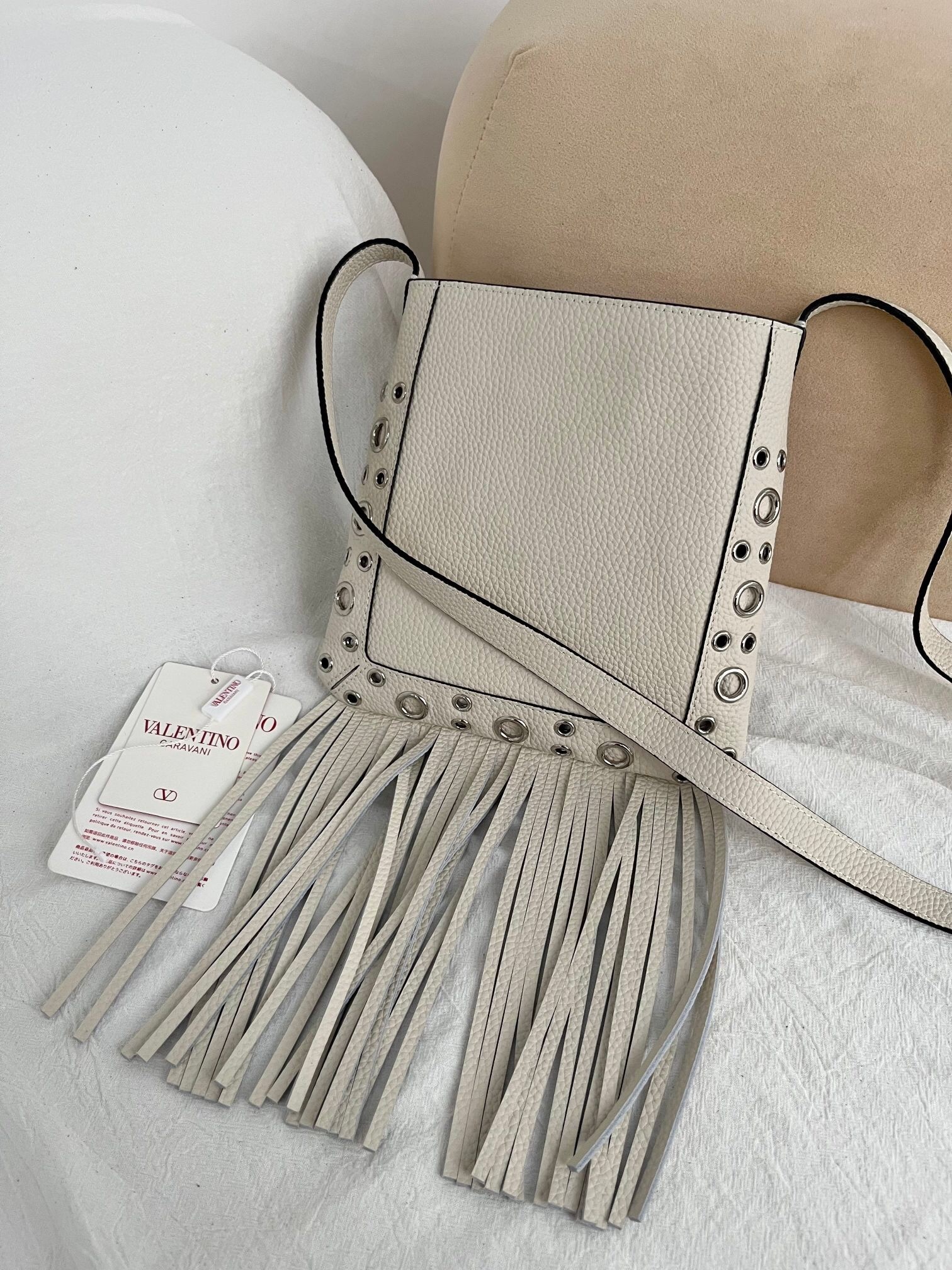 Valentino Garavani Nellcôte small fringe studded leather crossbody bag in light ivory
