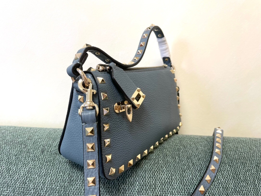 Valentino Garavani Rockstud small zipped crossbody bag in blue grained calf leather with gold-tone hardware and studs