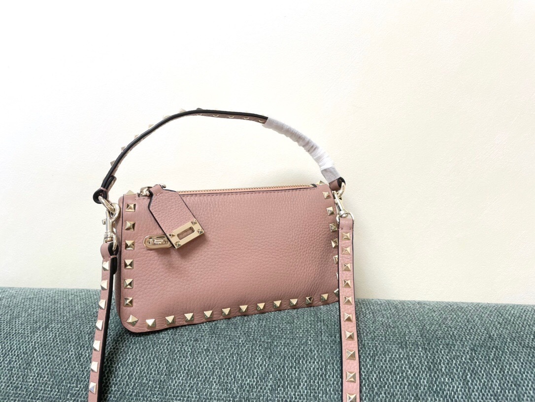 Valentino Garavani Small Rockstud crossbody bag in grainy calfskin leather with platinum-finished studs and a top handle