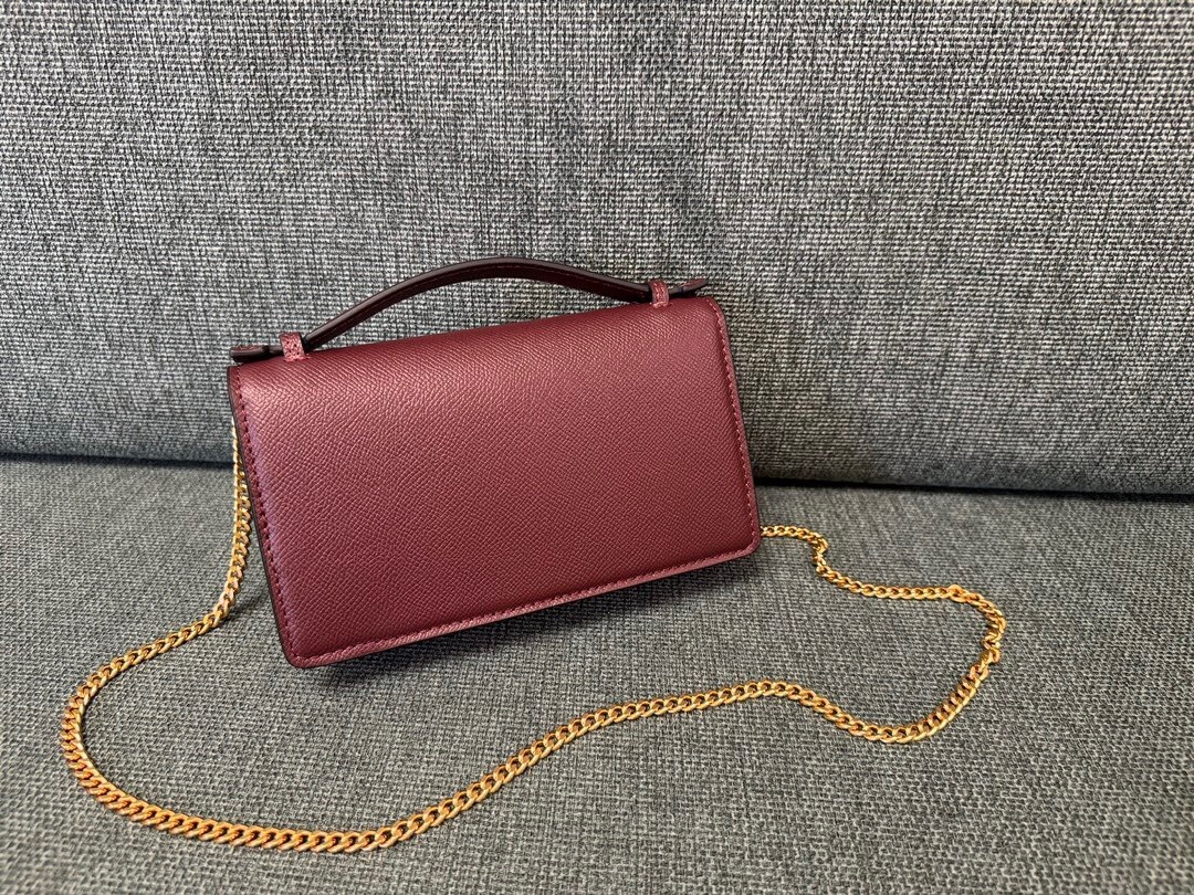 Valentino Garavani VLogo Small leather crossbody bag in the designer color Rosso V/Sabbia with gold hardware