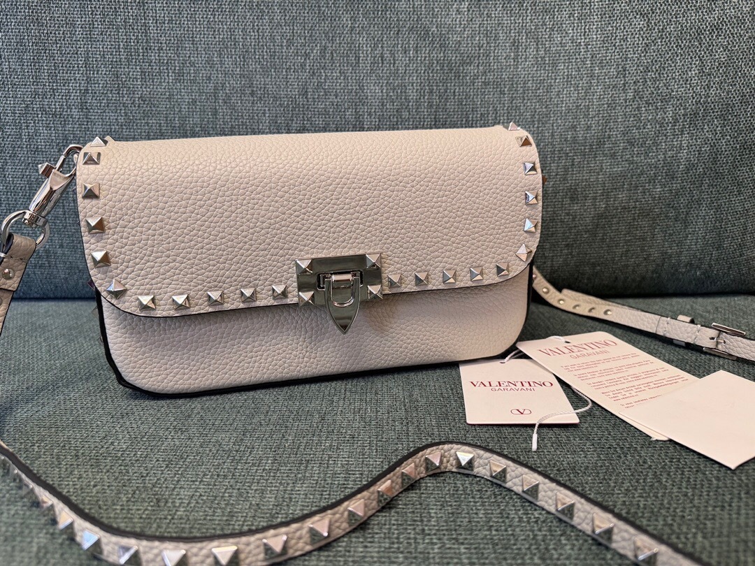 Valentino Garavani Rockstud small crossbody bag in ivory grained calfskin leather with platinum-finish metal studs