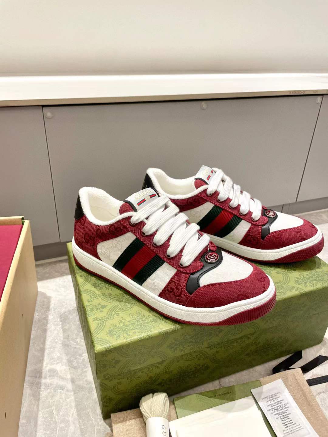 Gucci Men's Screener sneakers in Rosso Ancora GG canvas with a green and red Web stripe