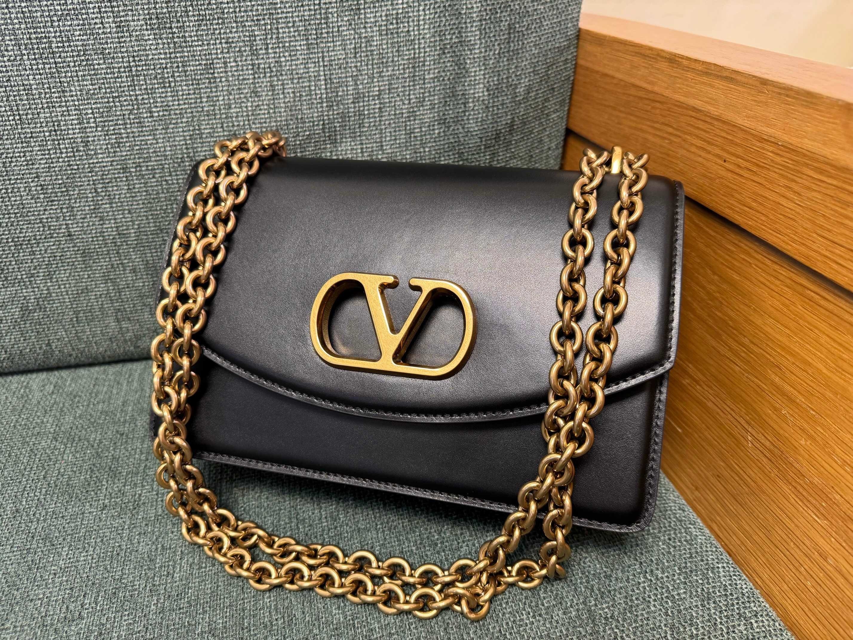 Valentino Garavani Vain small shoulder bag in shiny black calfskin leather