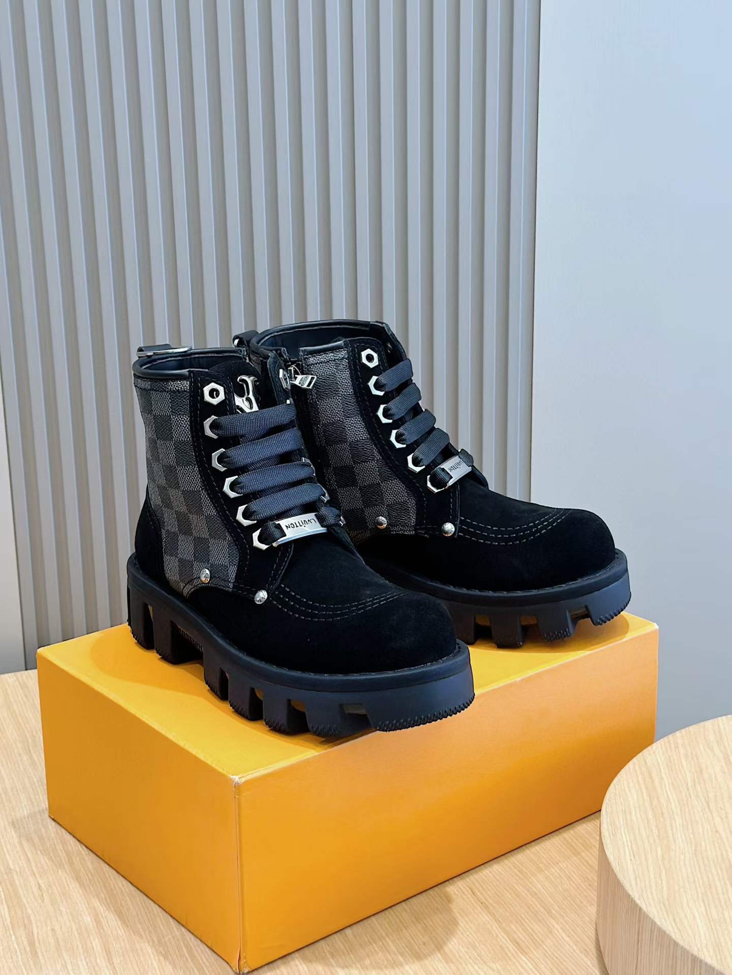 LV ankle boots featuring the Damier Graphite canvas pattern and black suede or nubuck leather