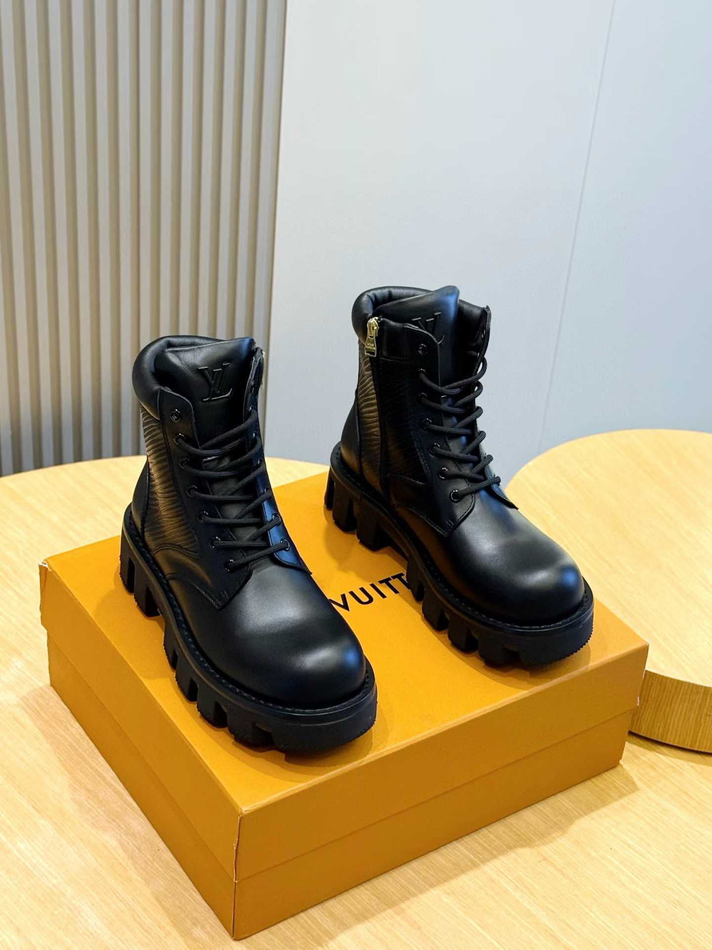 LV black leather combat boots