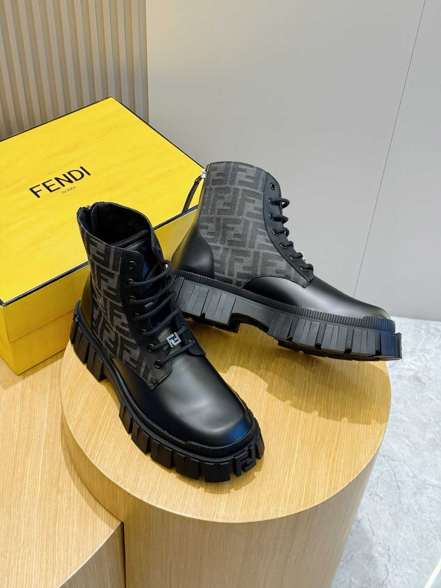 Fendi Force Biker Boots made of black leather with FF jacquard fabric details and a rubber lug sole