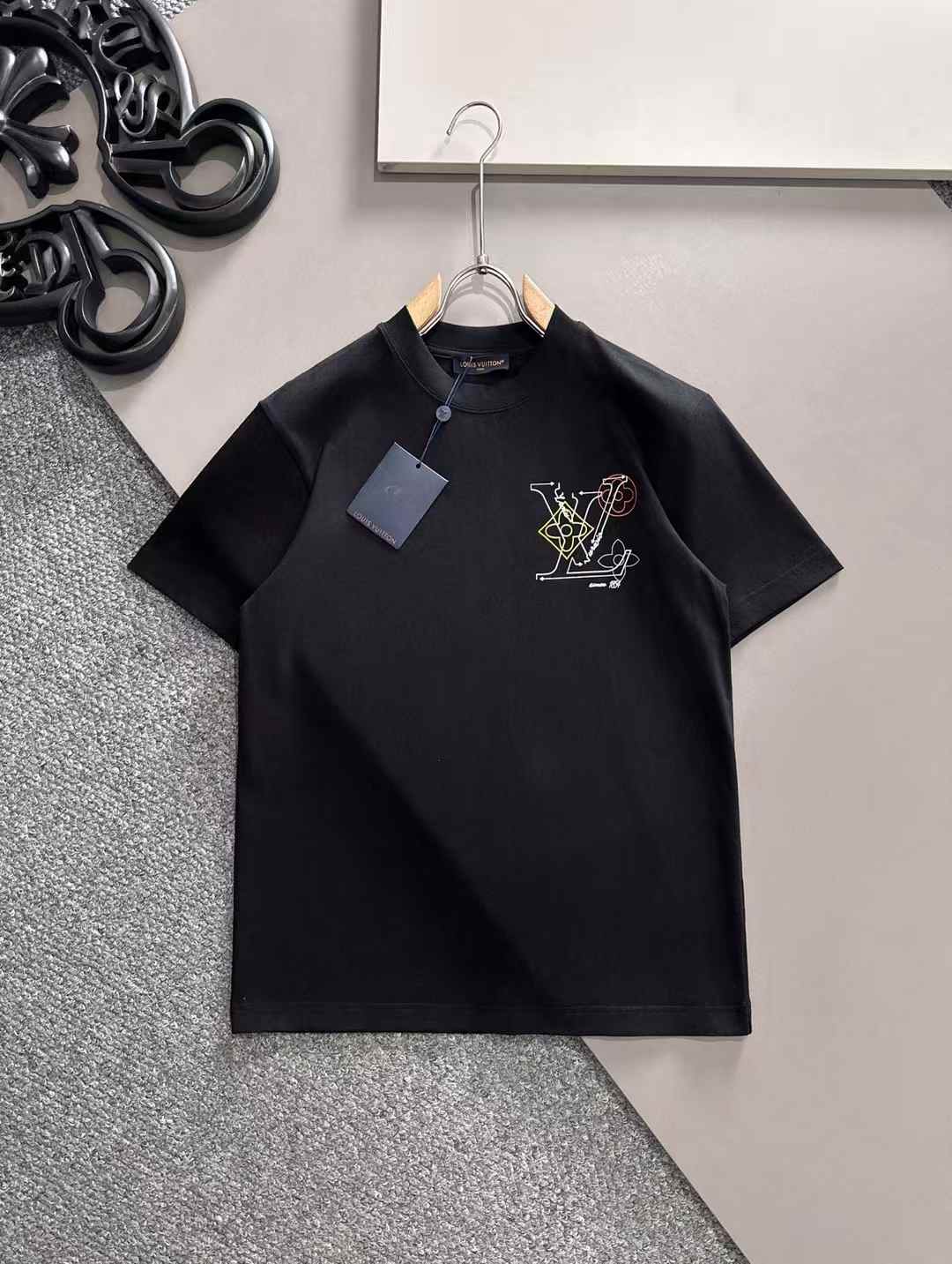 LV T-shirt featuring an embellished logo on the chest