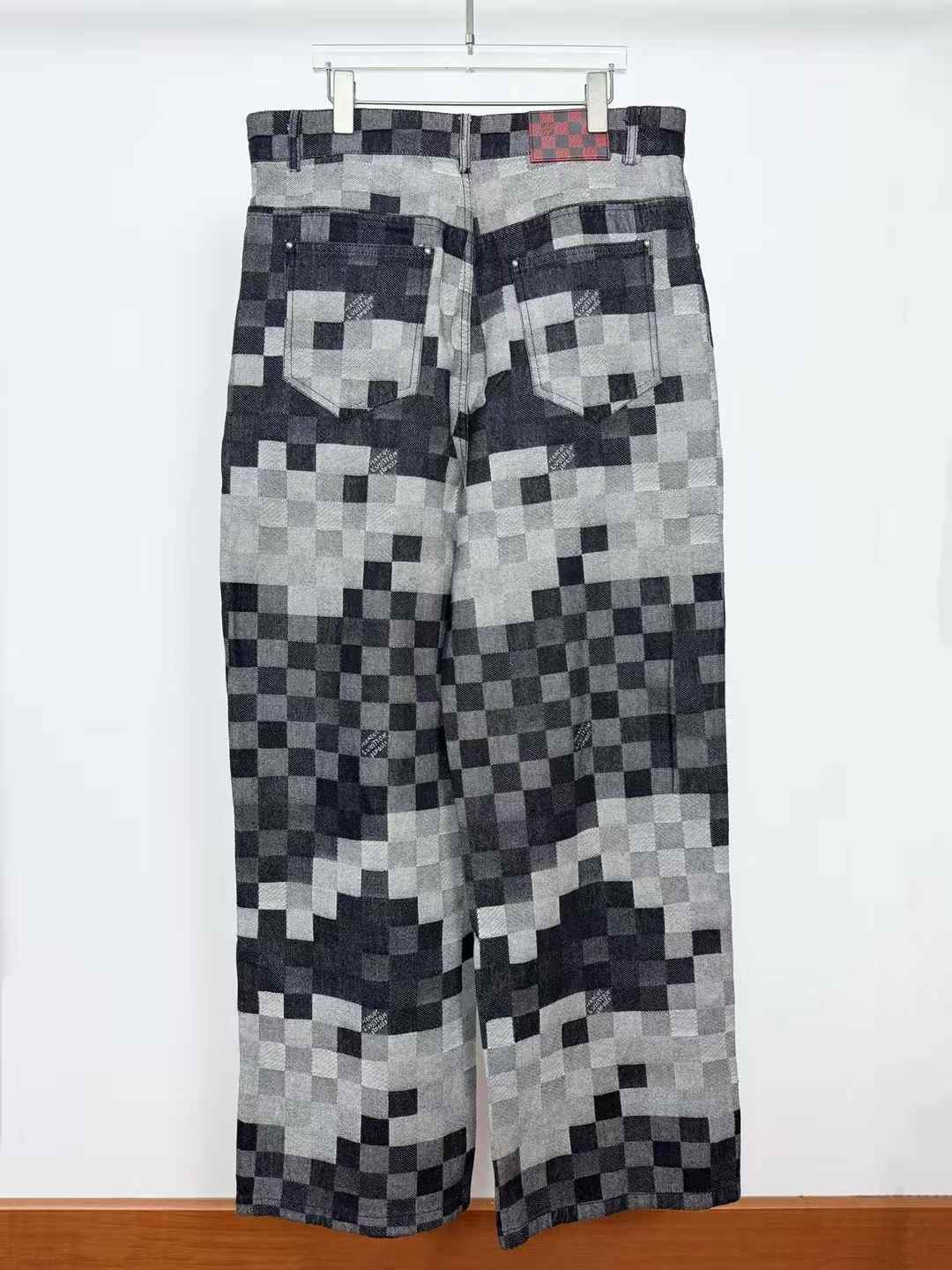 LV Damoflage Skate Denim pants in black tones graphic pixelated Damier jacquard pattern with "Marque L. Vuitton déposée" signatures integrated into the fabric