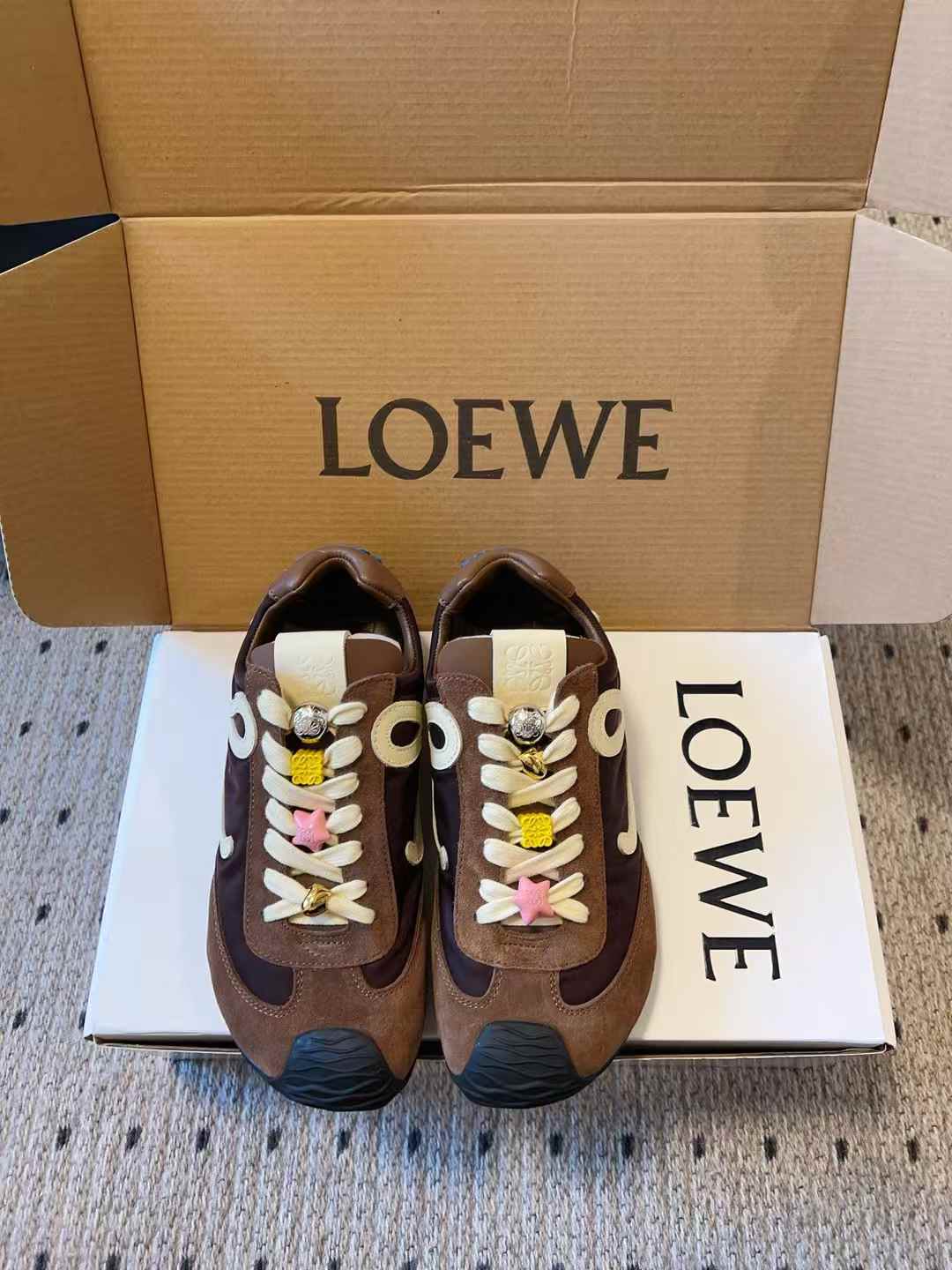 Loewe Ballet Runner 2.0 sneakers in a brown tone with a blue outsole and an off-white leather L monogram on the side