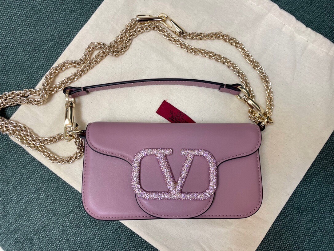 Valentino Garavani Locò small shoulder bag in calfskin leather with a crystal-embellished VLogo Signature element