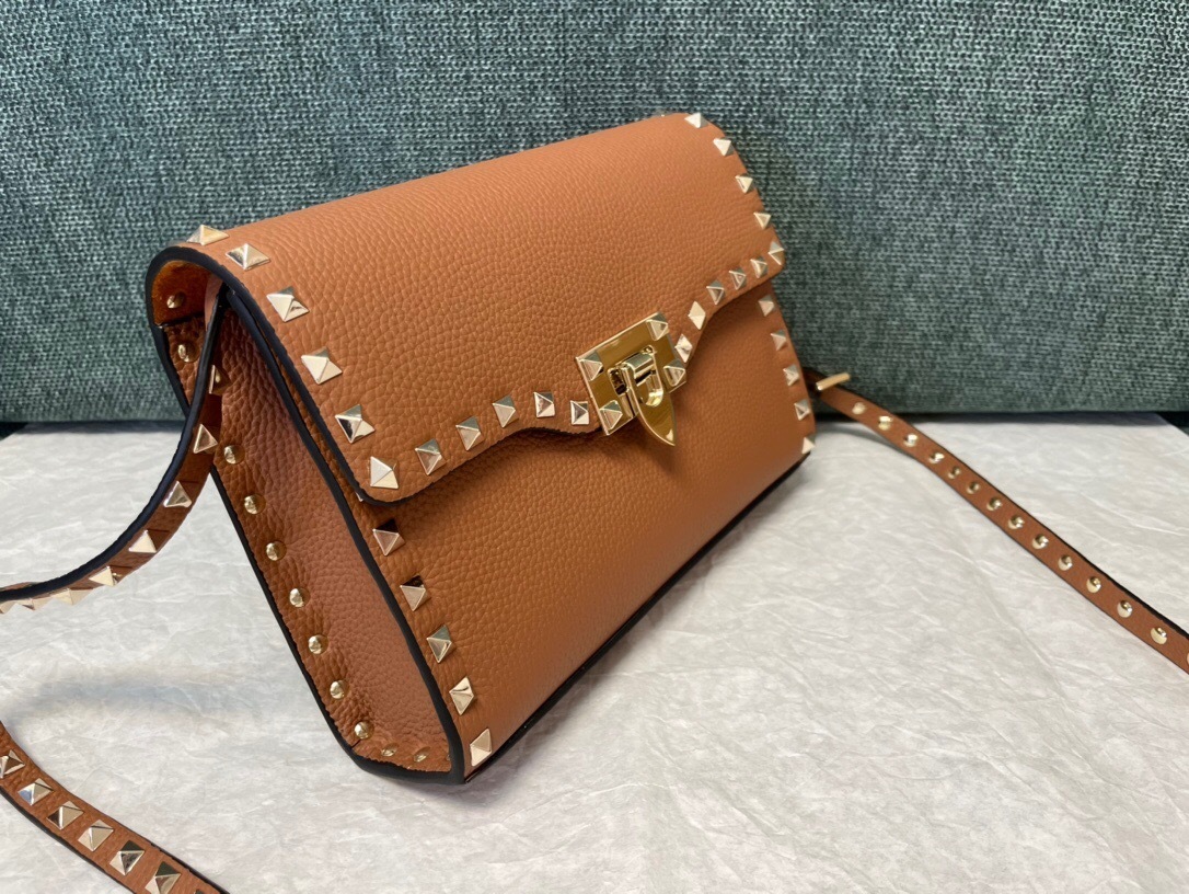 Valentino Garavani Rockstud small crossbody bag in brown grained calfskin leather with platinum-finish metal studs and hardware