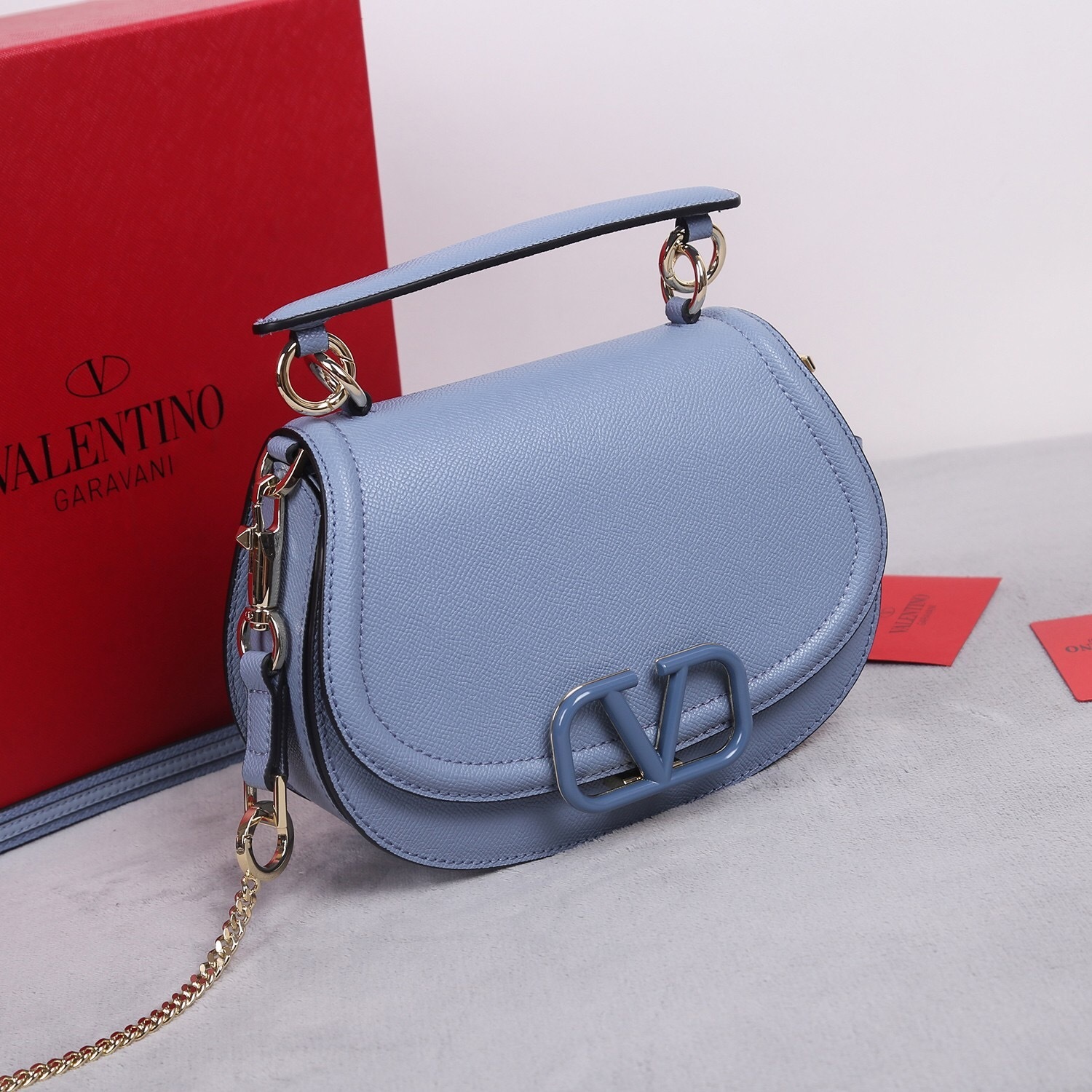 Valentino Garavani VLogo leather shoulder bag in a light blue color