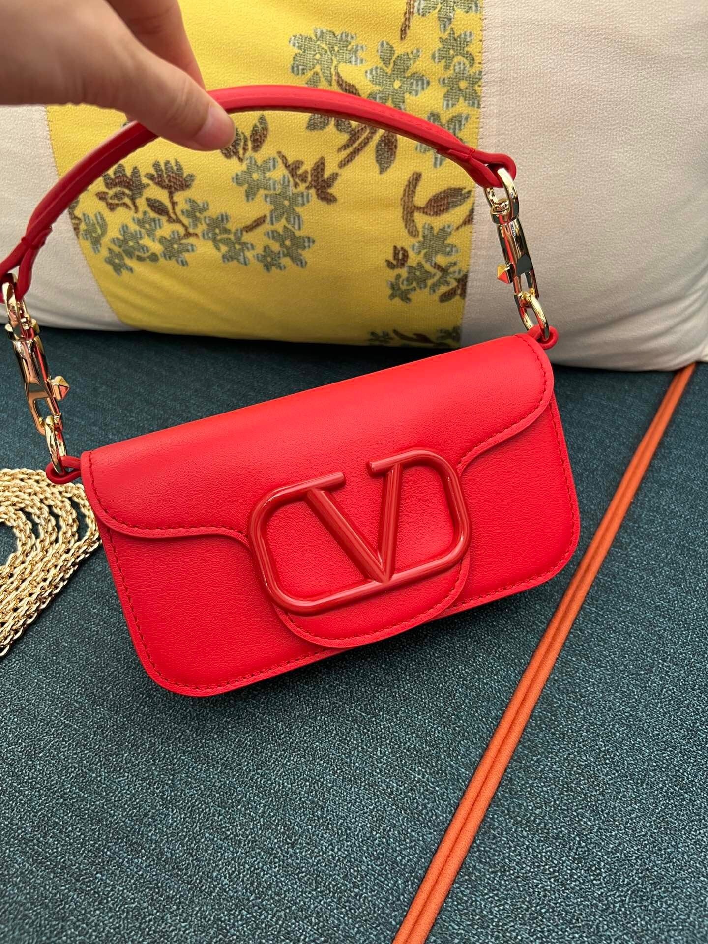 Valentino Garavani Locò shoulder bag in red calfskin leather with a tonal VLogo Signature element