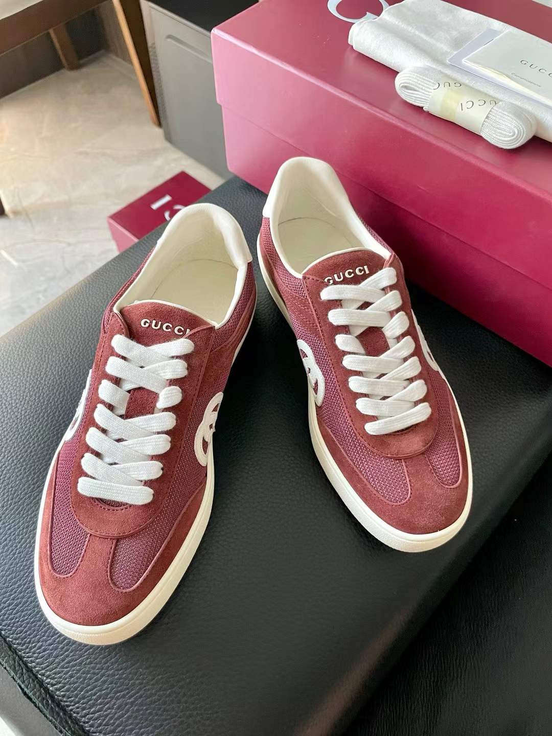 Gucci Interlocking G suede and canvas low-top sneakers in a bordeaux (red/maroon) color
