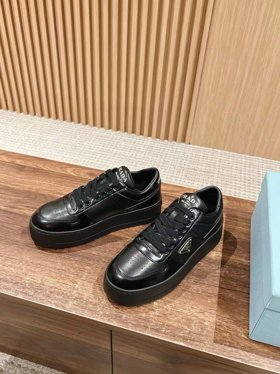 Prada Downtown Bold leather low-top sneakers in black