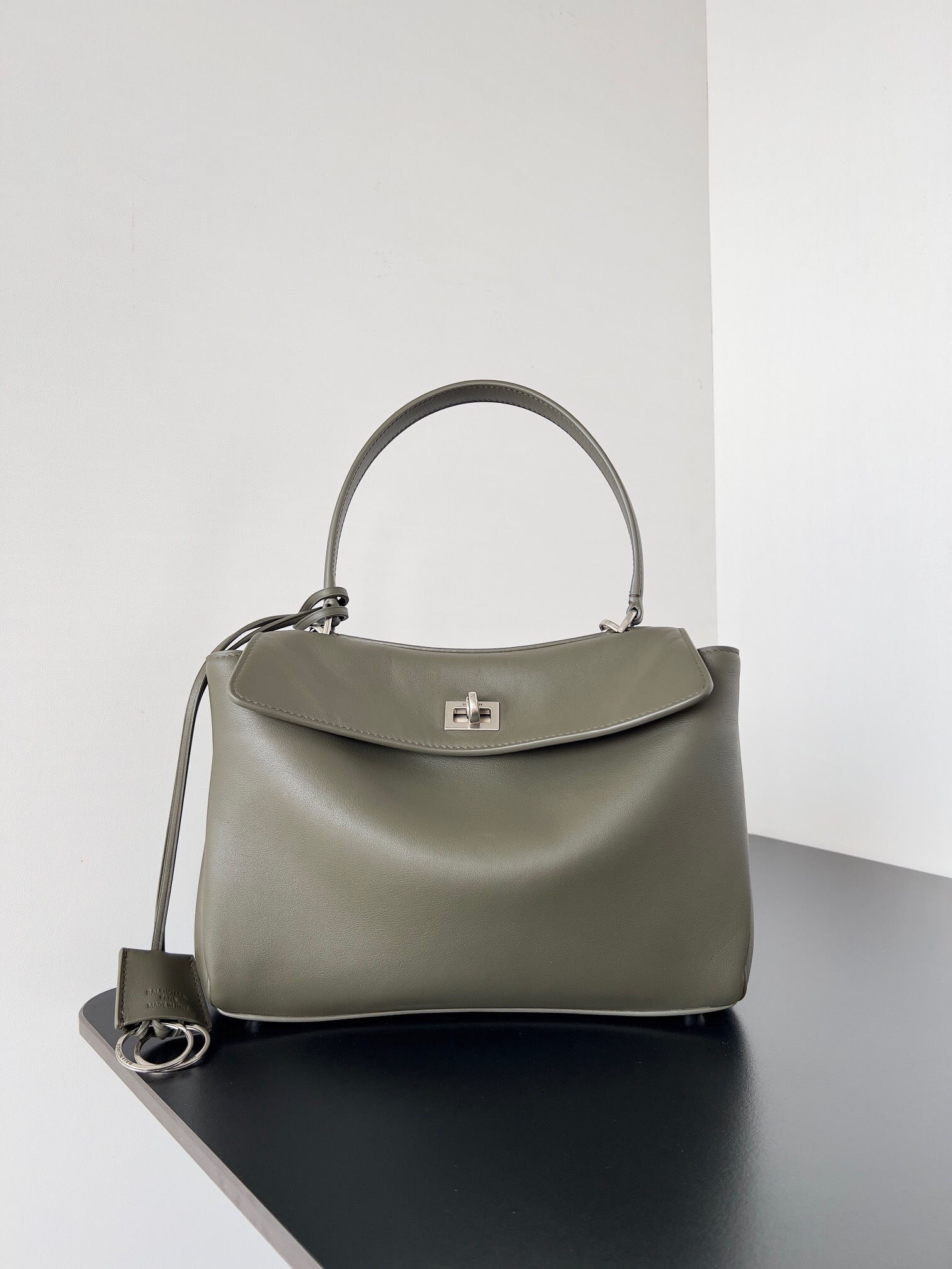 Balenciaga Rodeo Mini Handbag in smooth calfskin leather and a shade of green, possibly "khaki" or "dark green"