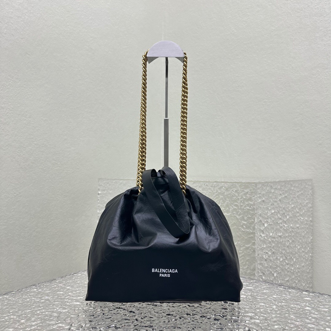 Balenciaga Crush Small tote bag in black calfskin leather with a gold-tone chain strap