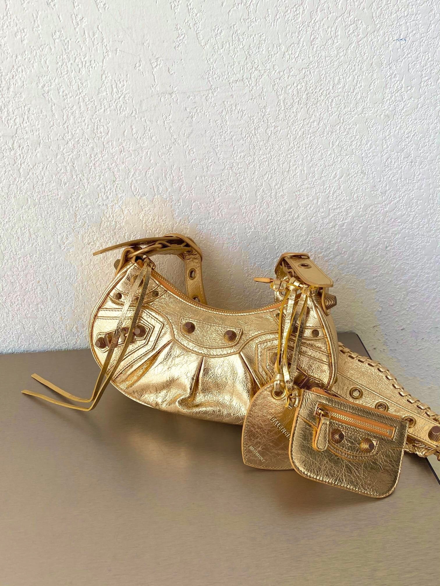 Balenciaga Le Cagole XS shoulder bag in lambskin leather gold