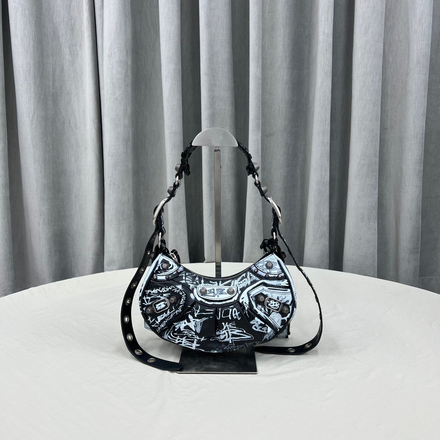 Balenciaga Le Cagole XS Graffiti shoulder bag in black and white Arena lambskin
