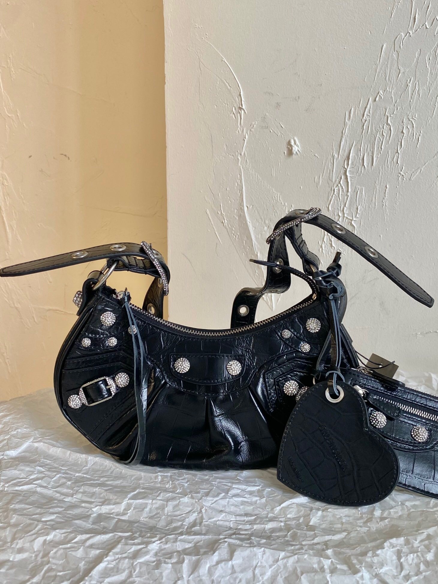 Balenciaga Le Cagole XS shoulder bag in black calf leather with rhinestone-embellished studs