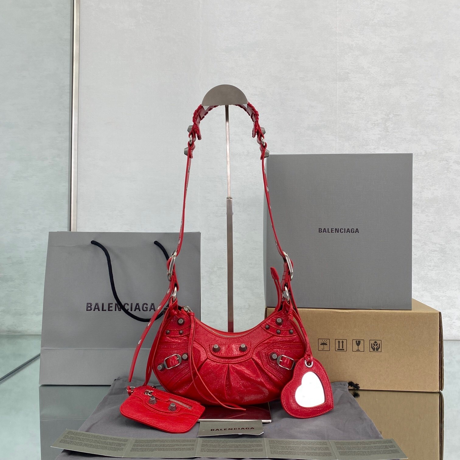 Balenciaga Le Cagole XS shoulder bag in tomato red lamb leather with silver-tone hardware