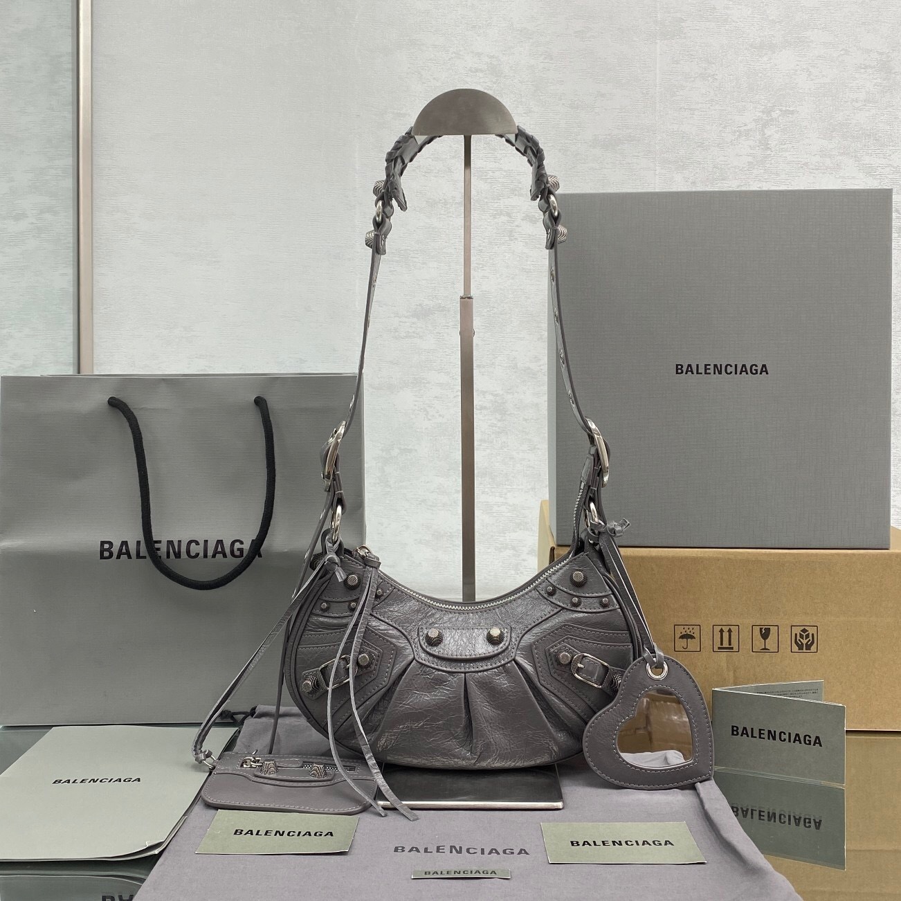 Balenciaga Le Cagole XS shoulder bag in dark grey or silver crinkled leather