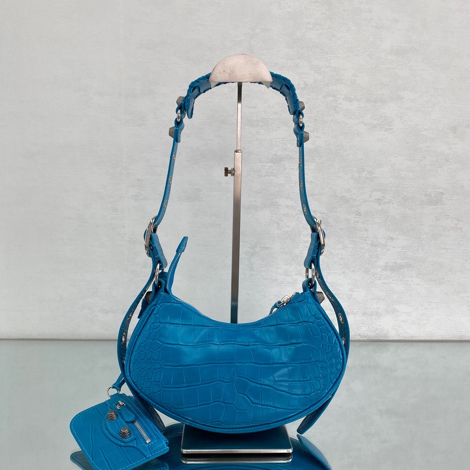 Balenciaga Le Cagole XS shoulder bag in sky blue leather with an embossed crocodile effect