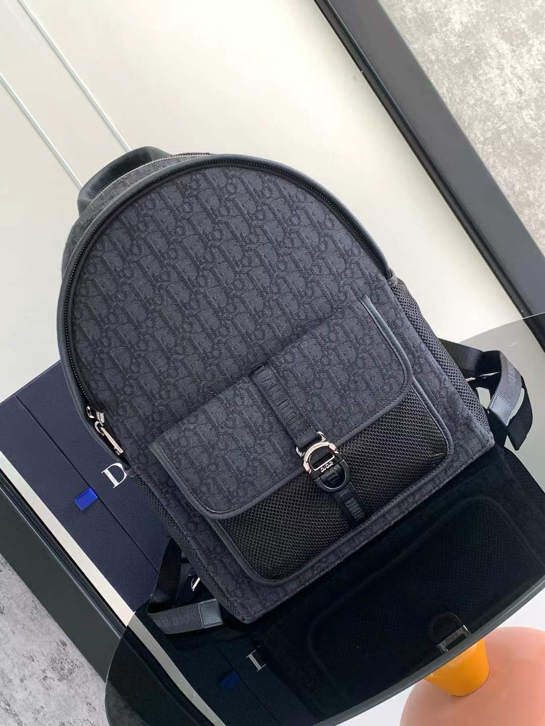 Dior 8 backpack in black Dior Oblique jacquard canvas with a front nylon and mesh pocket