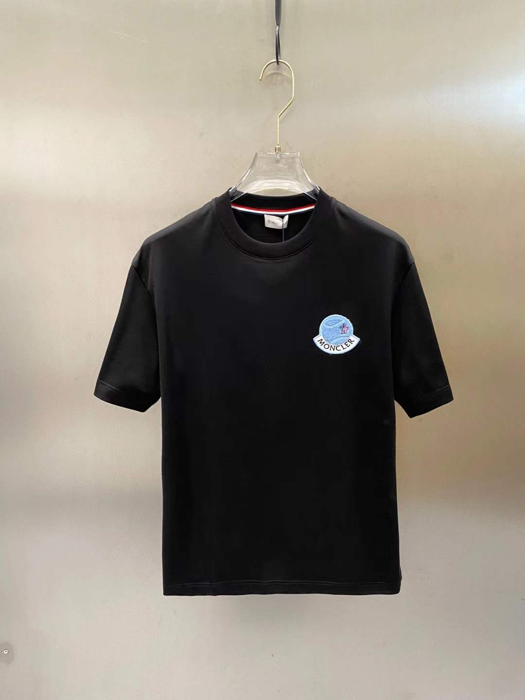 Moncler black crewneck t-shirt with a logo patch on the chest