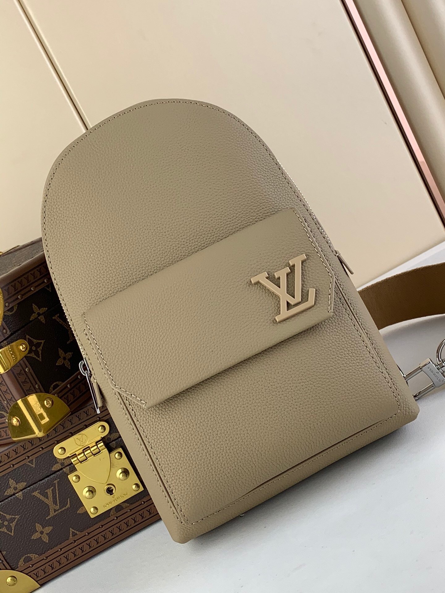 LV Grained Cowhide Aerogram Pilot Slingbag in Sable Beige