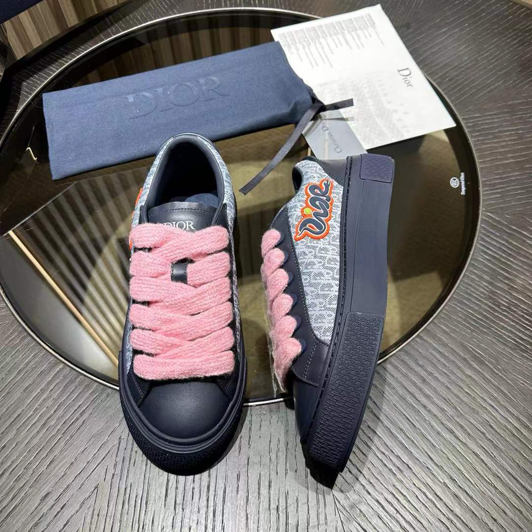 Dior B33 sneaker in navy blue and white Dior Oblique jacquard canvas with navy suede panels and wide pink laces