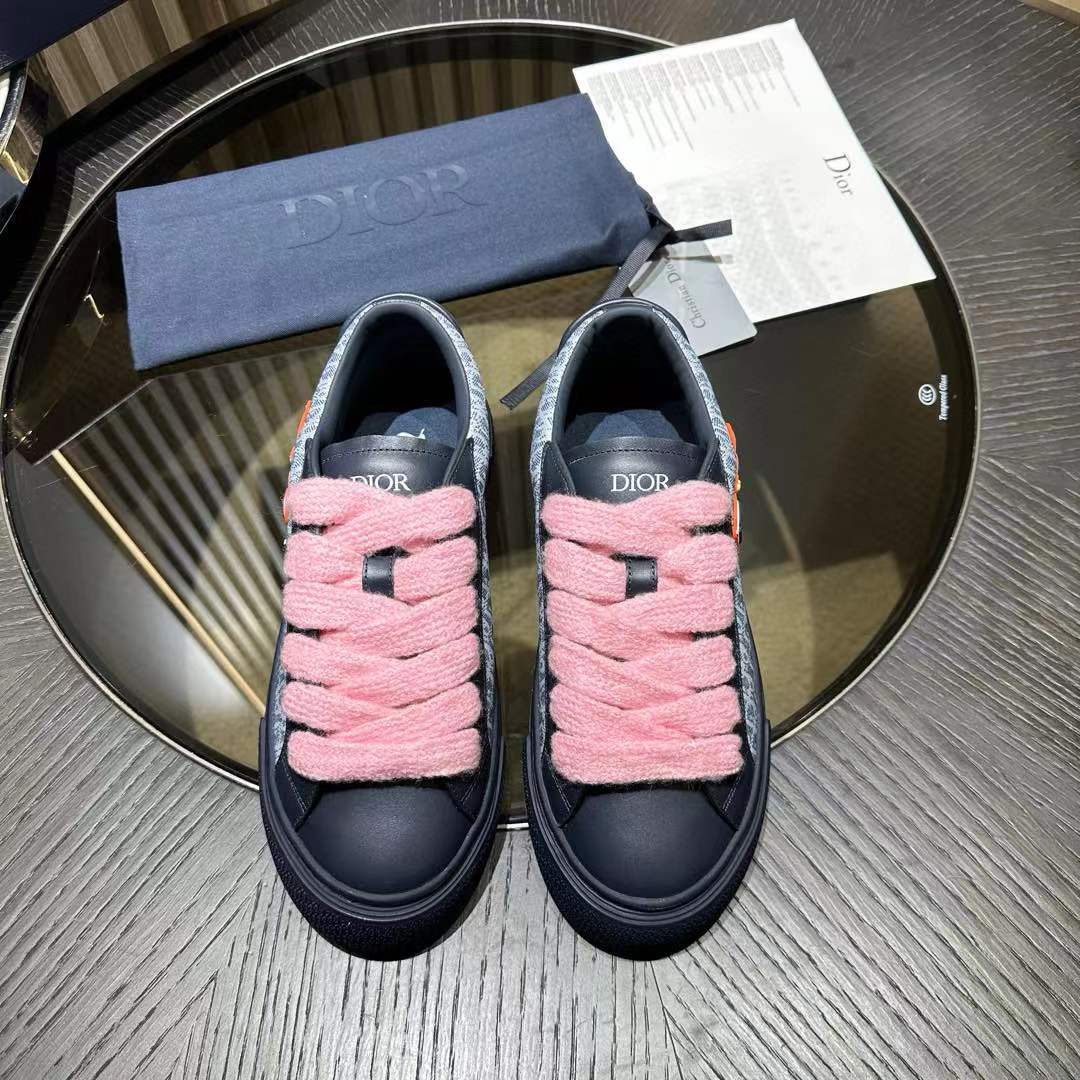 Dior B33 sneaker in navy blue and white Dior Oblique jacquard canvas with navy suede panels and wide pink laces