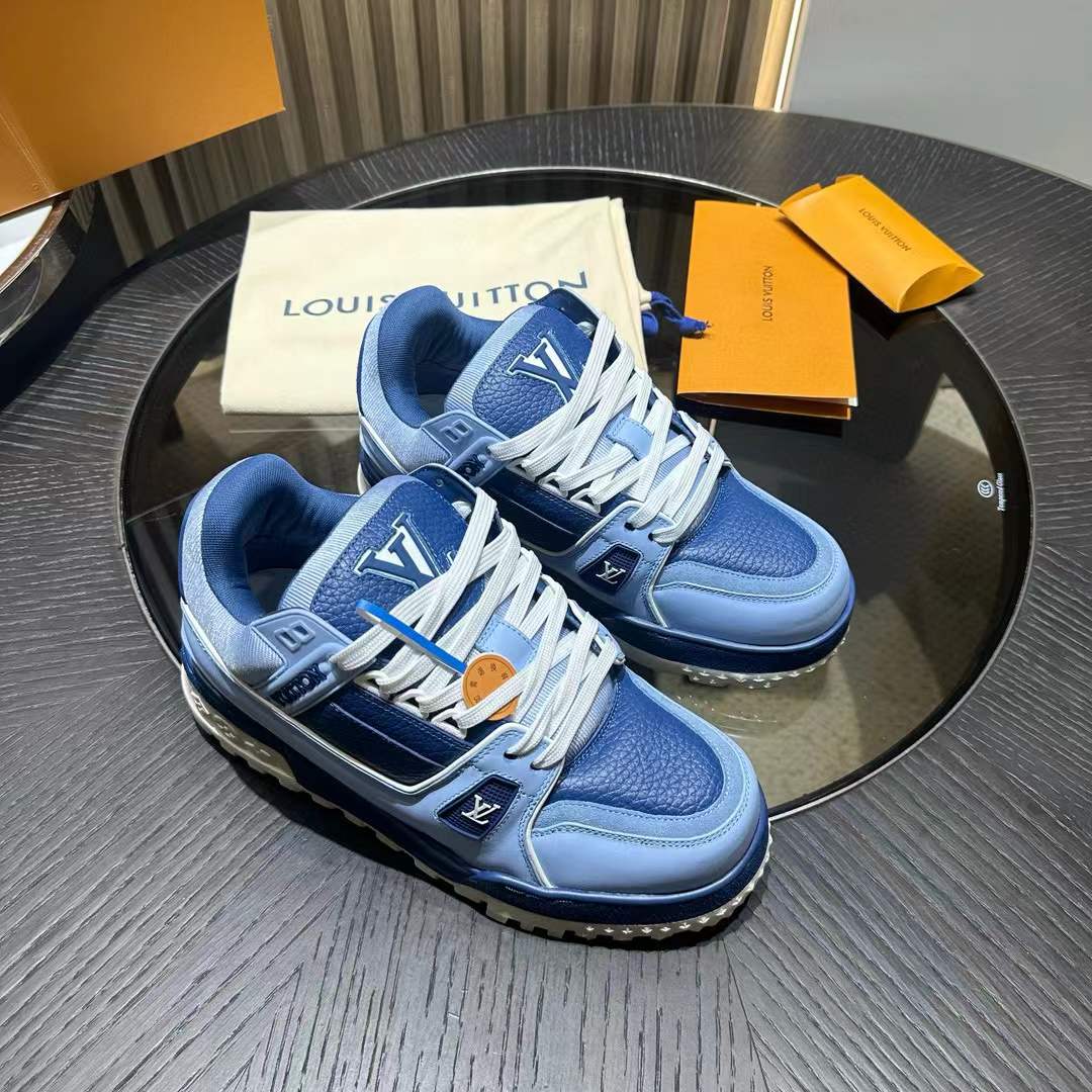 LV Trainer Maxi sneaker in blue, featuring a mix of plain, grained, and suede calf leather with an oversized fit and chunky rubber outsole.