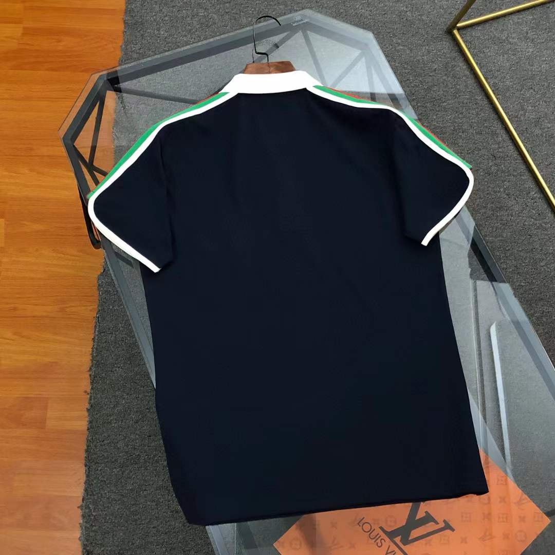 Gucci polo shirt with a white and black collar and signature Web-stripe trim on the sleeves