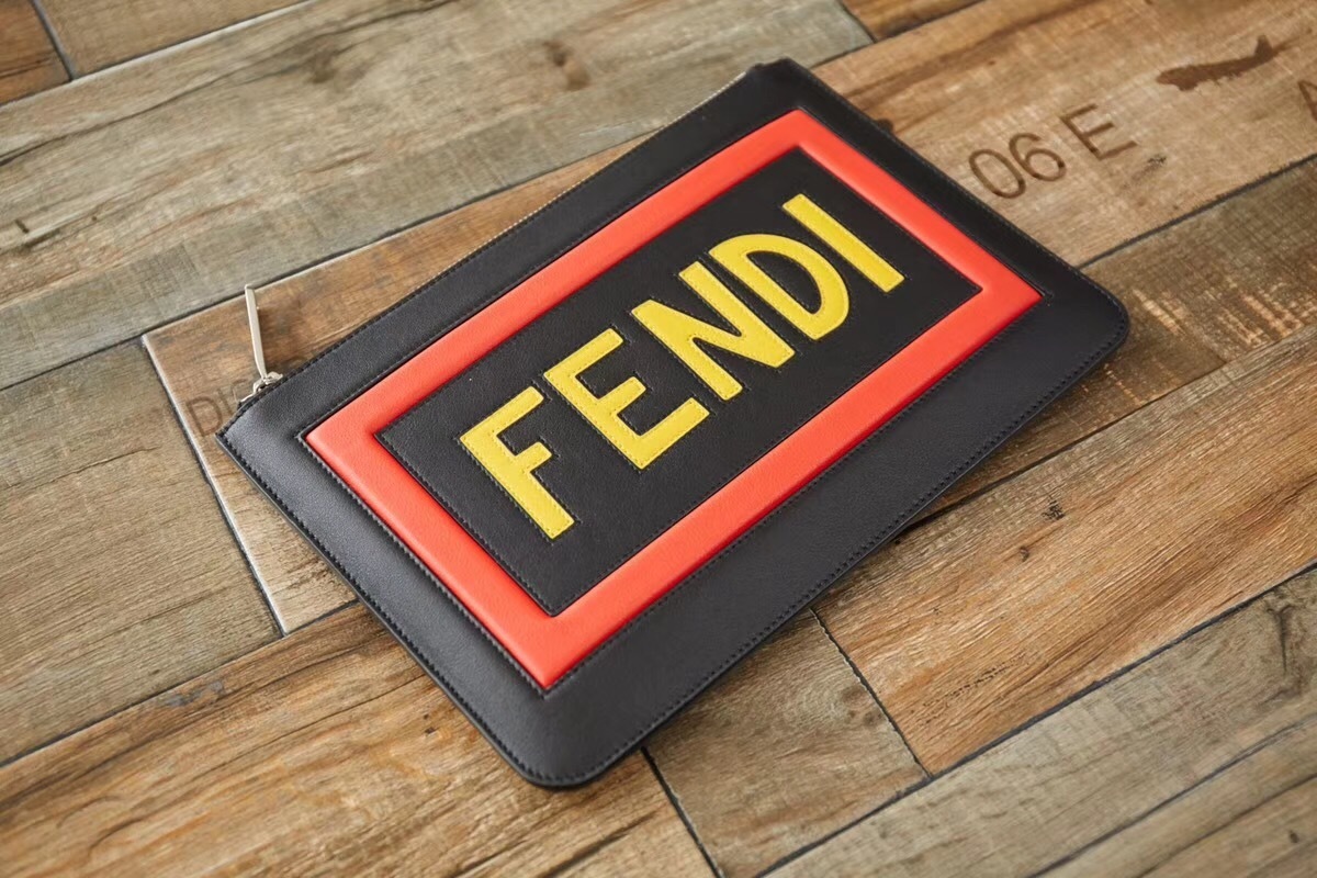 Fendi Think Vocabulary leather clutch in navy with a yellow and red logo