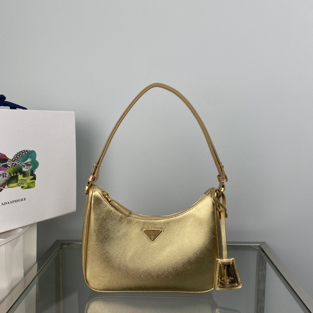 Prada Cleo or mini shoulder bag in gold Saffiano or brushed leather