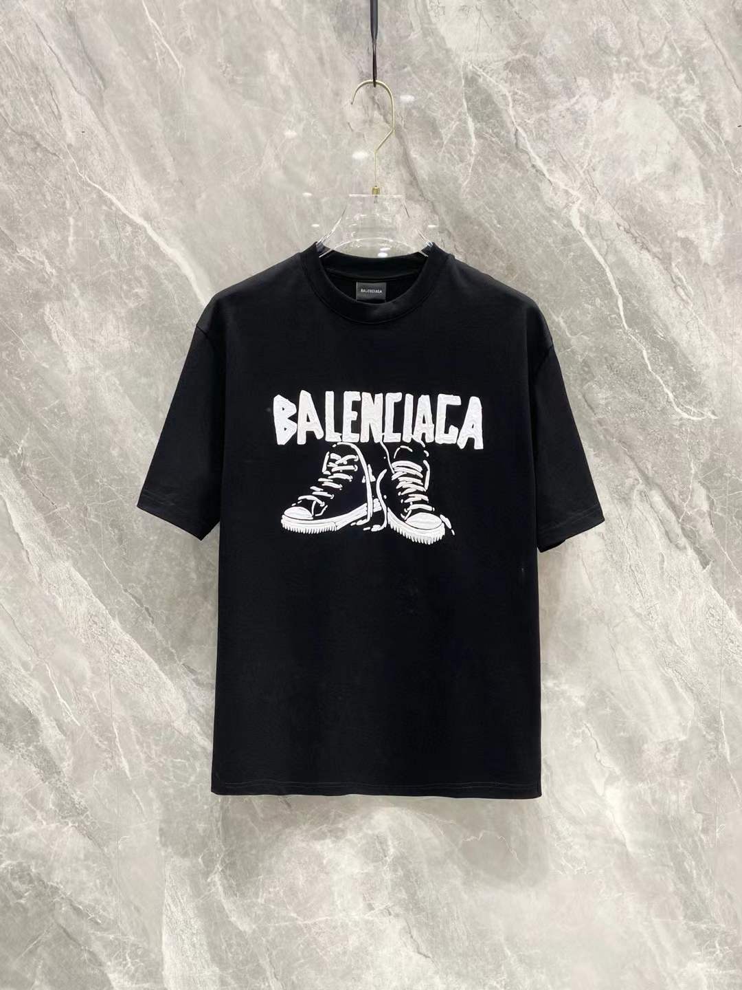 Balenciaga Black T-shirt with a logo and a graphic of high-top sneakers