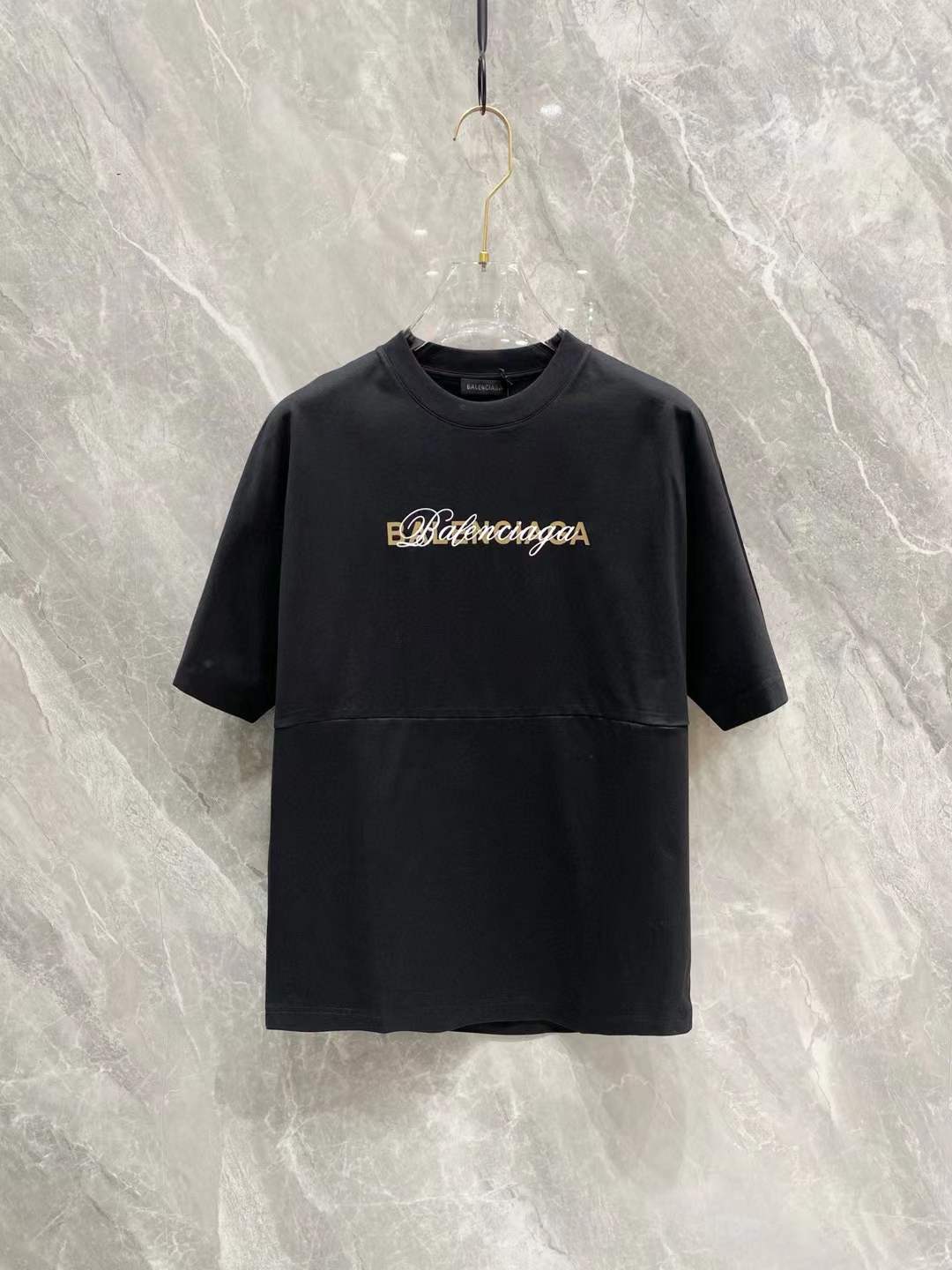 Balenciaga black cotton T-shirt with an embroidered logo script on the chest.