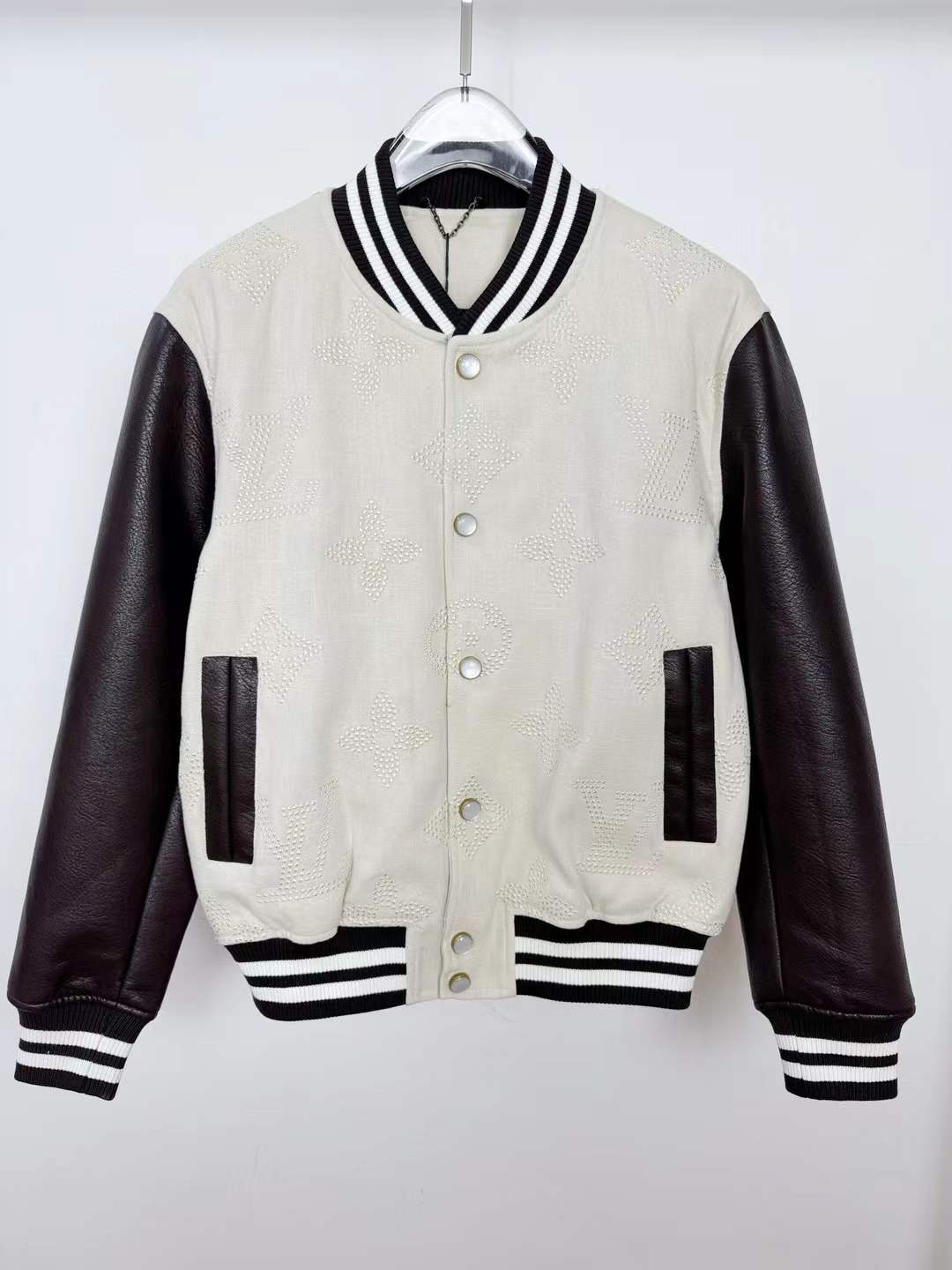 LV Leather Signature Varsity Jacket with a wool body and grained leather sleeves in black and white