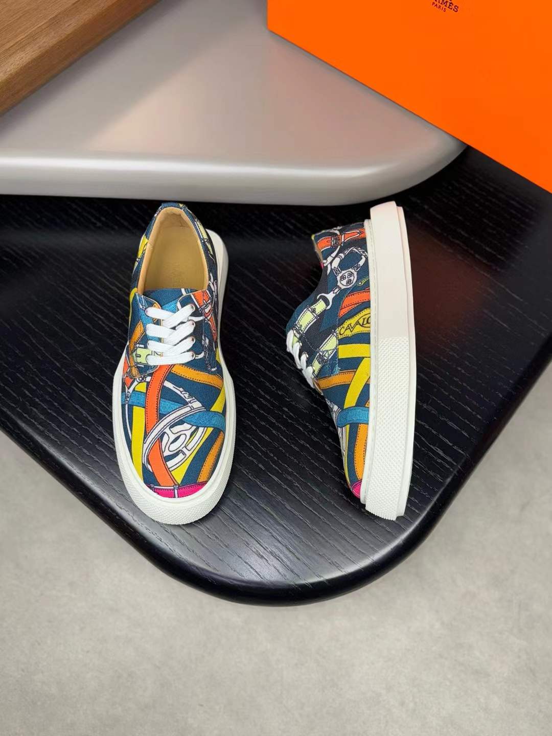 Hermès canvas sneakers featuring a multi-colored abstract print
