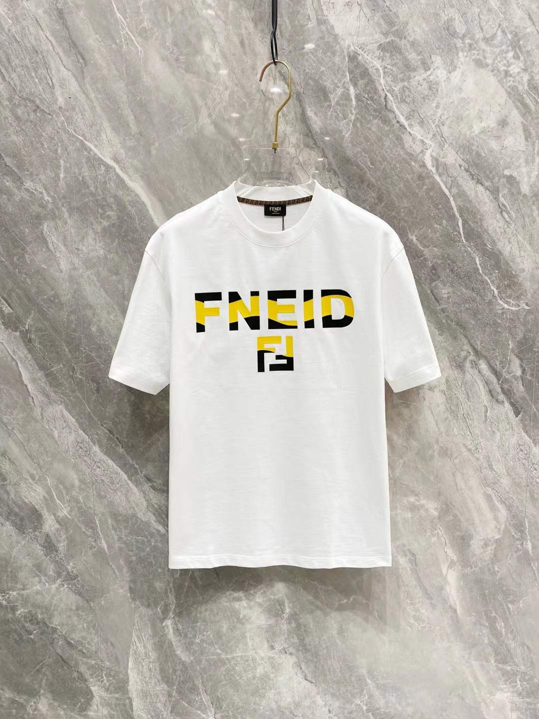 Fendi T-shirt white with a yellow and black "FNEID" logo print and the Fendi "FF" logo