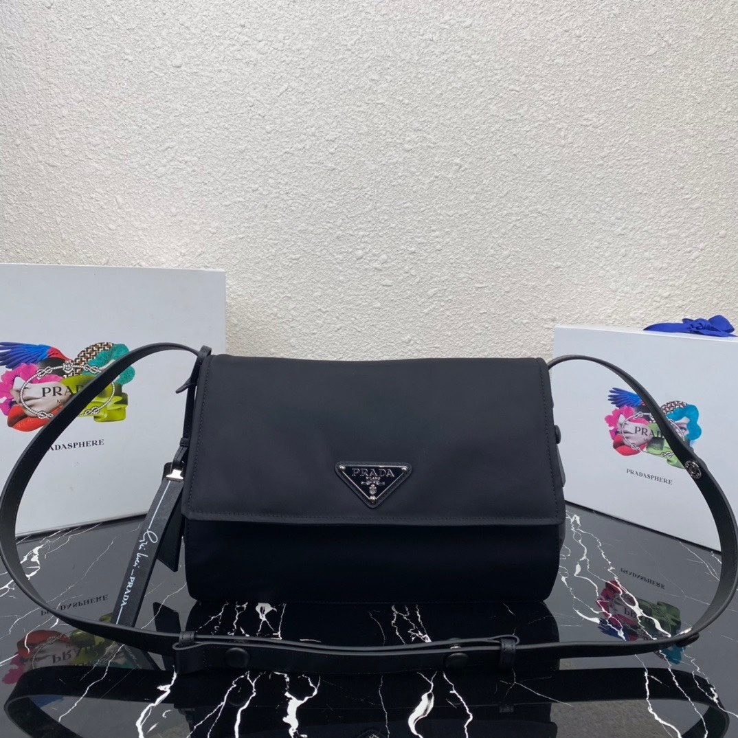 Prada padded Re-Nylon shoulder bag in black with a leather shoulder strap