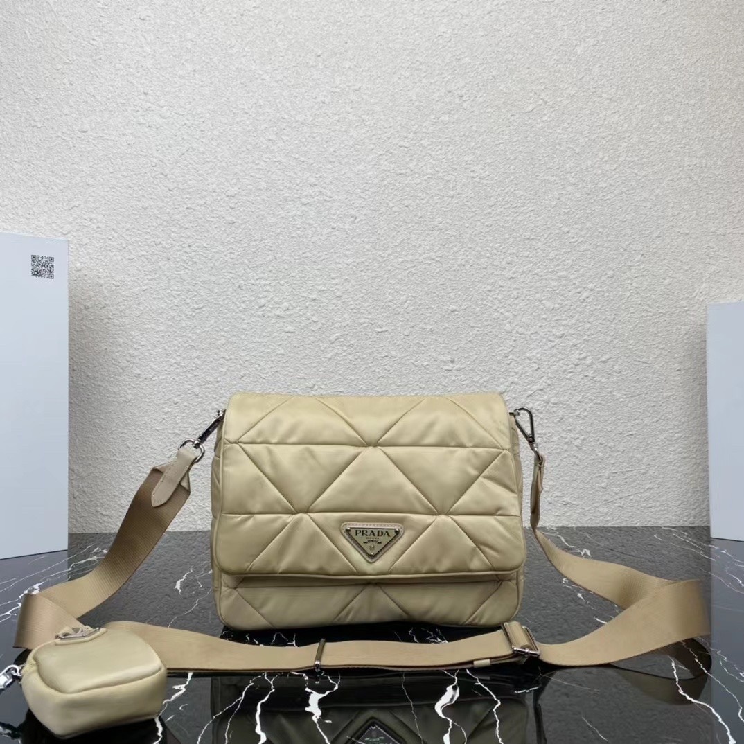 Prada Padded Re-Nylon Flap Shoulder Bag in the Deserto (light beige) color