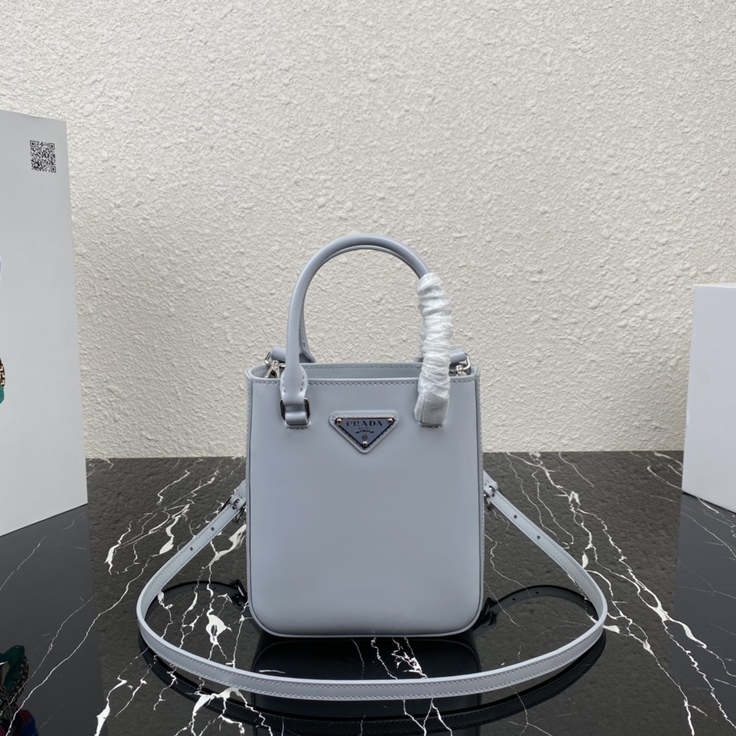 Prada Small Brushed Leather Tote Bag in a light blue or grey-blue color