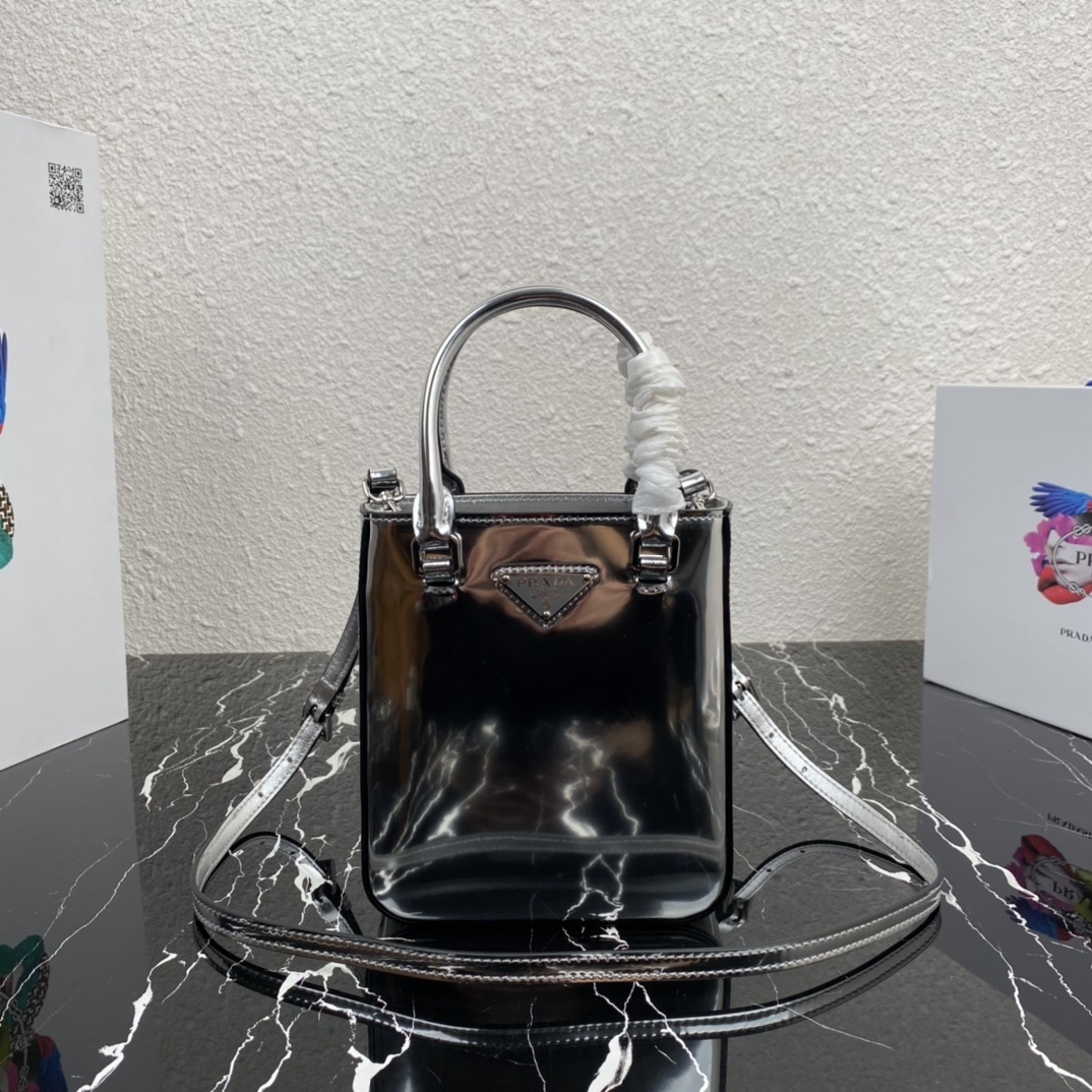 Prada mini bucket bag in black patent leather