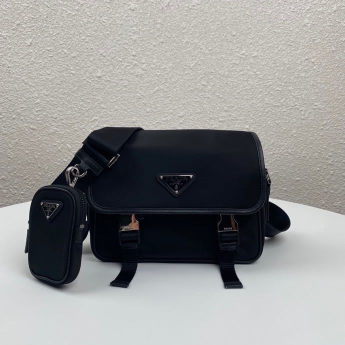 Prada black Re-Nylon and Saffiano leather shoulder bag with an adjustable shoulder strap and a removable pouch.