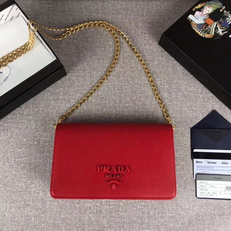 Prada Saffiano Lux flap bag with a gold chain strap red