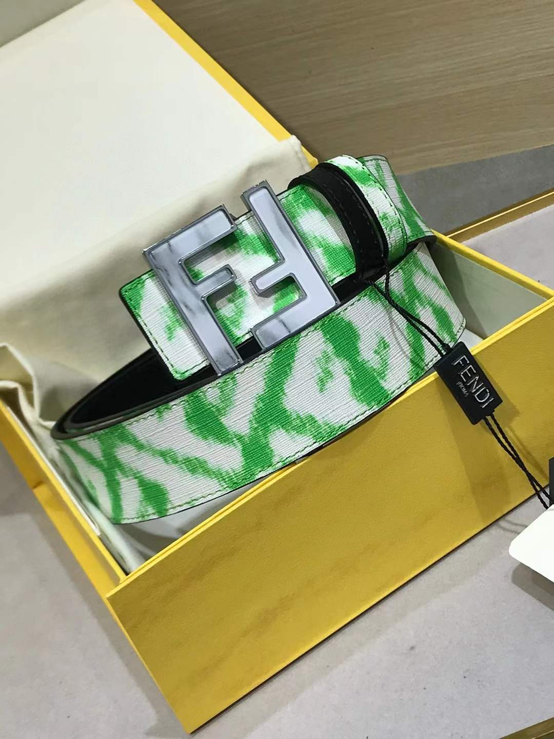 Fendi belt with a green and white pattern and a silver-tone FF logo buckle