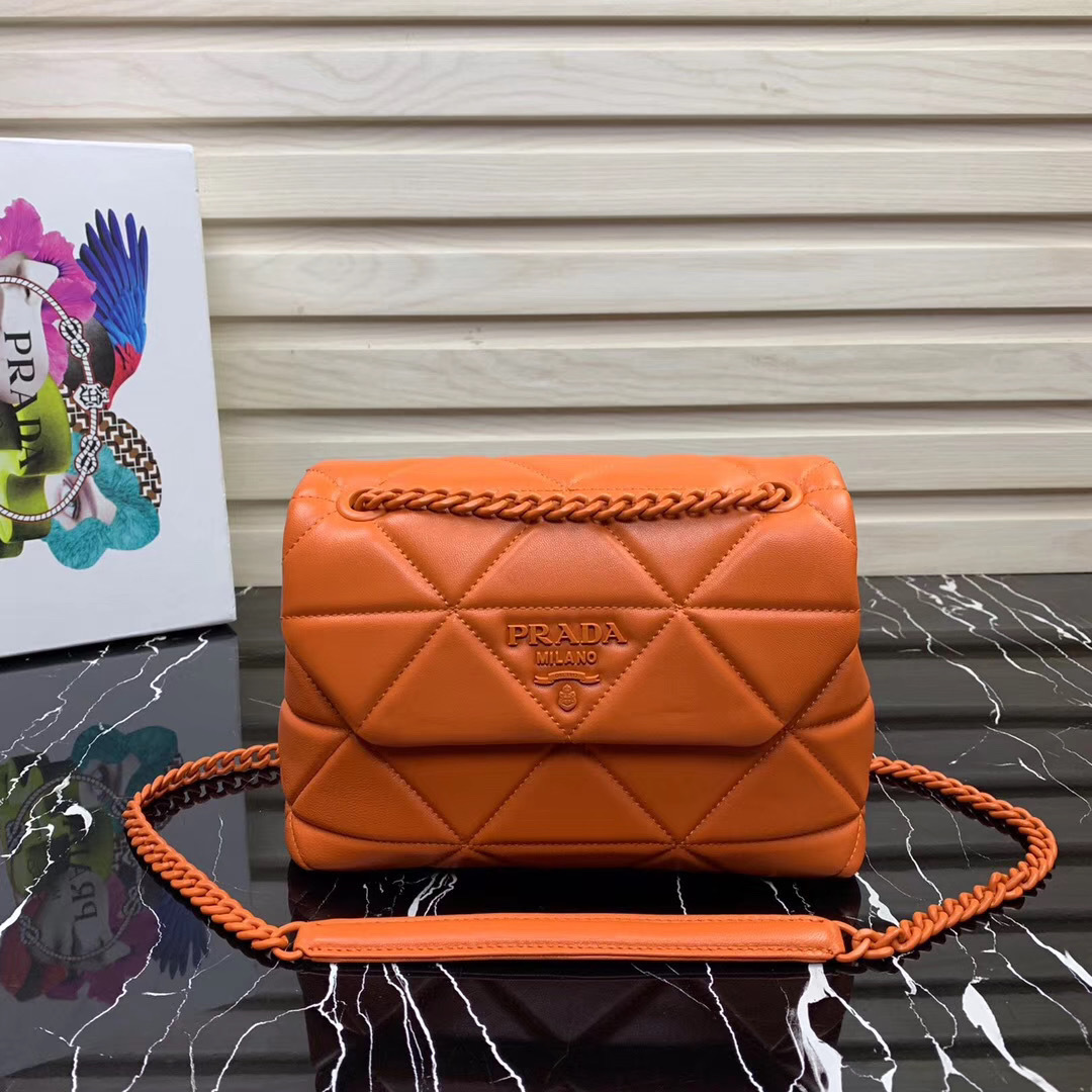 Prada Spectrum shoulder bag in an orange/brown color